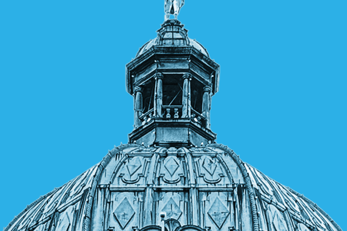 Dome of the BC Legislature on a blue background