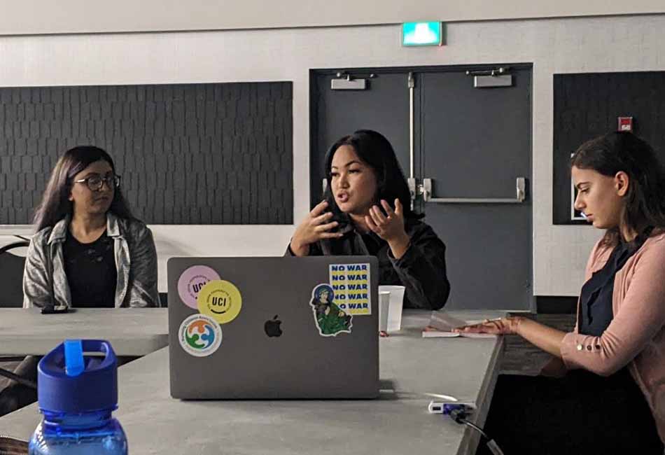 Three participants in a seminar